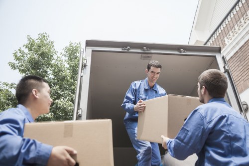 Professional movers handling a small household relocation