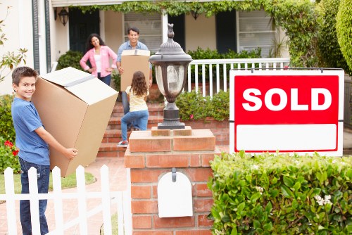 Arranging furniture and boxes in a new home after moving
